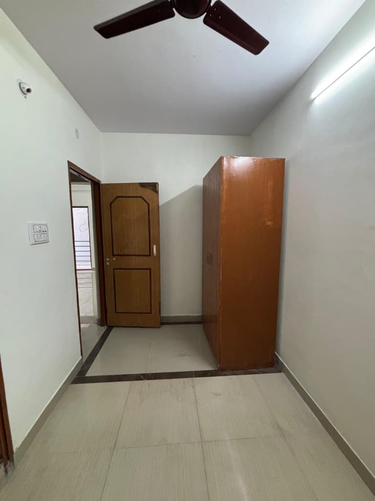 SLN Homes individual wooden almirah wardrobe and tiled room space in HSR Layout